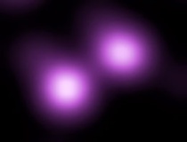 SN 2006gy (rechtsboven) en zijn melkwegstelsel NGC 1260 (linksonder) in valse kleuren. Chandra X-Ray Observatory.Bron: Wikipedia